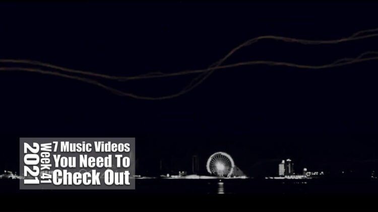 Still from Aysula's music video for "twelve". The image focuses on the skyline during night time.