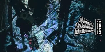 A still from Sore Demo Sekai Ga Tsudukunara's music video for "流星群 (Meteor Shower)". The four members of the band perform on a floor with draped cloths. A number of lights are shining on the floor, giving it an illuminating spacy effect. The musicians themselves are not in the light, so they have become silhouettes. It was filmed from above.