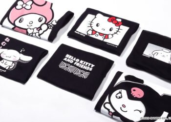 A couple of black-coloured hoodies and shirts folded neatly with the prints of My Melody, Cinnamorroll, Hello Kitty, Pomponpurin, and Kuromi visible. There is also a print of Hello Kitty and Friends on a black-coloured shirt. Kaomoji x Sanrio "Hello Kitty and Friends" collection © 2023 Sanrio Co.,LTD.
