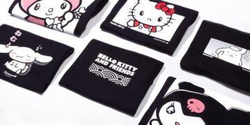 A couple of black-coloured hoodies and shirts folded neatly with the prints of My Melody, Cinnamorroll, Hello Kitty, Pomponpurin, and Kuromi visible. There is also a print of Hello Kitty and Friends on a black-coloured shirt. Kaomoji x Sanrio "Hello Kitty and Friends" collection © 2023 Sanrio Co.,LTD.