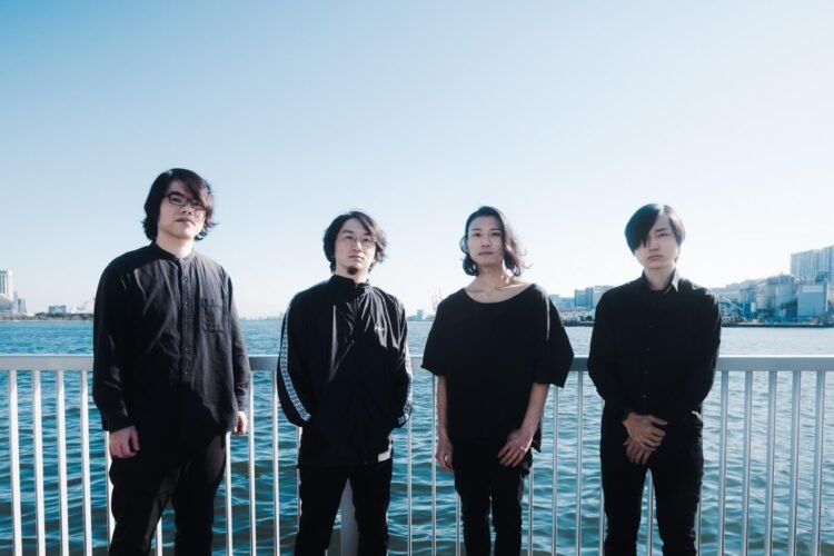 The four members of Asunojokei are all dressed in black clothes while the background is light because of water and air. © Asunojokei