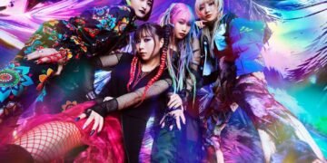 The four band members of HANABIE. are posting for a photo and surrounded by bursts of vibrant colours. Photo by Yuuto (@musicmagic3923 on Twitter)