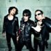 The current three men of Guitar Wolf: guitarist and vocalist Seiji, bassist Gotz and drummer Takuro, dressed in black leather.