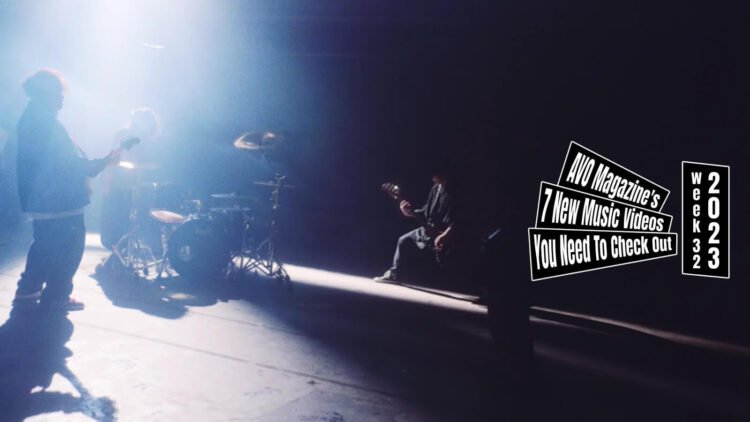 Still from the music video "NUE" by borderline case. The still shows the four band members of borderline case almost finishing playing the song while being in a deserted building, which might be a factory hall. The still is mirrored.