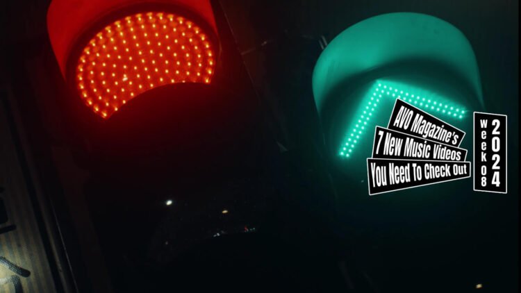 Still from the song "飽く迄も (Akuma Demo)" by ざらばんし (Zarabanshi). The still depicts a red traffic light on the left and a green traffic light with an arrow on the right.