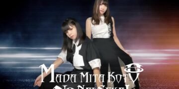 The photo shows the duo of Madaseka, Hime Hashimura and Mitsuru, each in contrasting black and white outfits. The background has blue and red colours, and stripes have been added on top of the picture, perhaps to give the idea that the photo can be seen on an old (TV) screen.