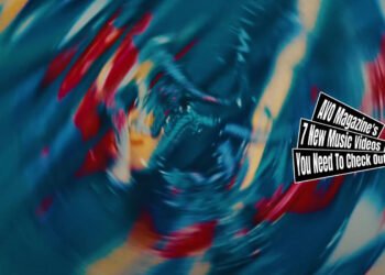 Still from Er's music video for "風船 (Balloon)". Something that looks like a painting spins around in the picture, making it look blurry, but also artful.