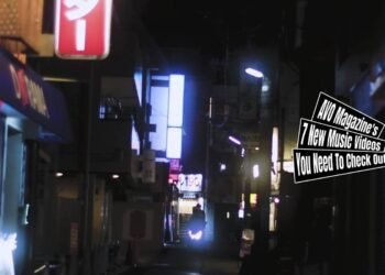 Still from in sea hole's music video for "baby baby baby". A street at night capturing a scooter that is coming towards to camera. Director of Photography and Edited by Emily Inoue