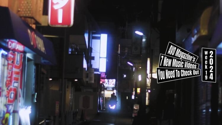 Still from in sea hole's music video for "baby baby baby". A street at night capturing a scooter that is coming towards to camera. Director of Photography and Edited by Emily Inoue