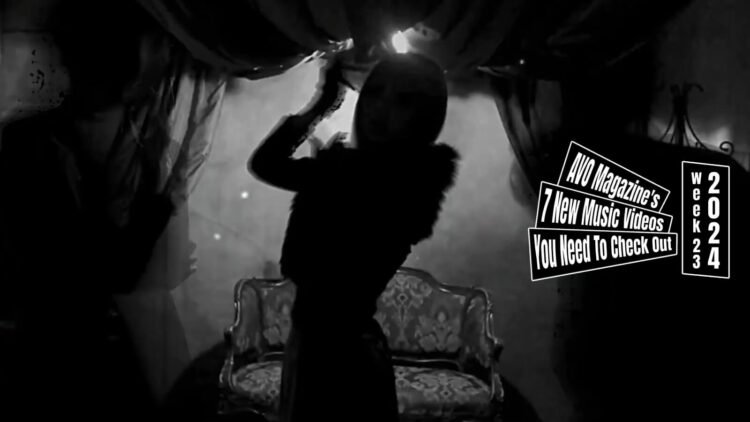 Still from Remnant's music video for the song "Re:Incarnation". The still features silhouettes of Remnant's three band members, they are standing in a dimly lit room with a sofa against the wall. The still is a bit blurry as they are moving in the still which adds a spooky element.