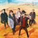 The image is an anime-style illustration featuring the five members of FLOW in an open, desert-like landscape with a mountain range in the background. The members of FLOW are drawn in an anime style, which is fitting as their world tour is titled "Anime Shibari". FLOW © AMUSE INC.