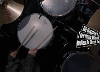 Still from the music video by the band mel for the song "Yours". The still is an overhead view of the drummer of the band mel playing the drums. The video is directed by Kohei Yamashita.