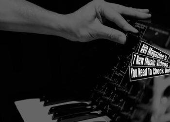 Still of the song "spotlight girl" byタラチネ (Tarachine). The still is a close-up view in monochrome where one of the members of the band interacts with audio equipment, precisely turning a dial on a synthesiser. The music video is directed and edited by Makoto Sukegawa, camera work by schun,sk.