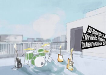 This still is the ending scene of the animated music video for the song "夏暁 (Late Summer)" by the band なるぎれ (Nargile). The ending scene depicts an illustration of a school rooftup setup with musical instruments, such as a drumkit and electric guitars. The scene is set against a backdrop of a clear blue sky with a couple of clouds.