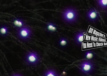 Still from MON/KU's music video for "産毛 (Fluff)". Fireworks on display in the night sky.