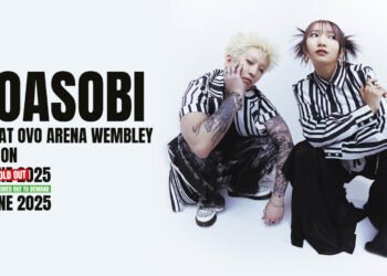 Photo of the duo YOASOBI dressed in coordinated black and white striped clothing and squatting close to each other for a pose. Next to it is the promotion for their first European headlining show in London.