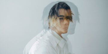 Double exposure photo of vocalist and guitarist Atsushi (of Centimillimental) in a white dress shirt.