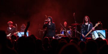 A photo taken during the Esprit D'Air show at Academy 2 in Manchester by JJ Grant/Wonderlens. It captures a dynamic concert scene with audience in front of the stage and the band performing in the back of the photo.