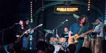 Photo shows a lively scene of the band kanekoayano performing at the Hare & Hounds in Birmingham. There are five musicians on stage. Photography by JJ Grant/wonderlens