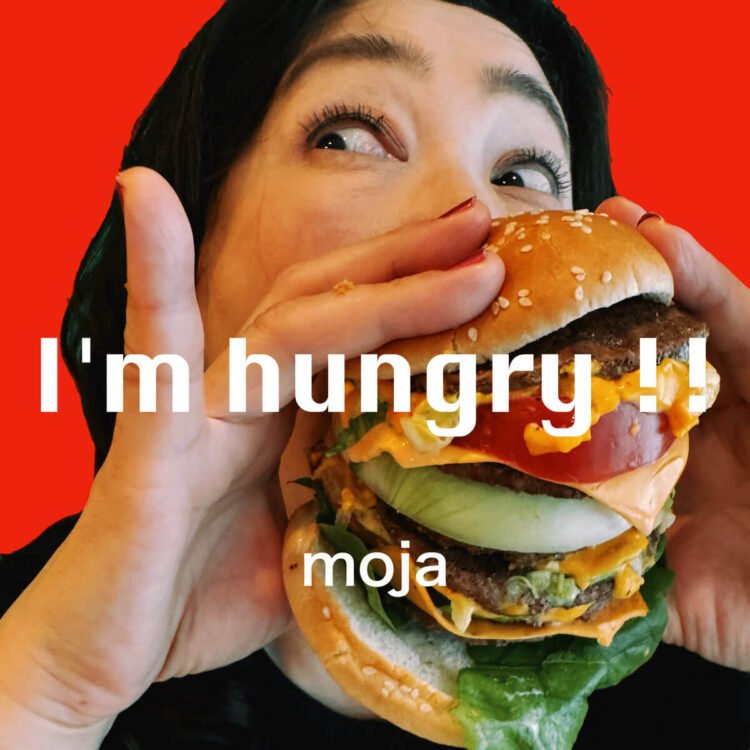 'I'm hungry !!' album cover, where one of the band members of Moja is eating a cheeseburger.