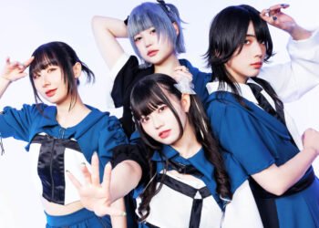 The photo features the four members of Broken By The Scream posing while standing near each other against a light background. They are wearing coordinating costumes in the colours blue with white and black elements, each having a unique hairstyle. © Broken By The Scream / Metal Blade Records