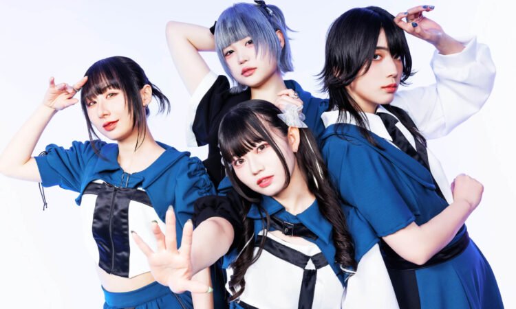 The photo features the four members of Broken By The Scream posing while standing near each other against a light background. They are wearing coordinating costumes in the colours blue with white and black elements, each having a unique hairstyle. © Broken By The Scream / Metal Blade Records