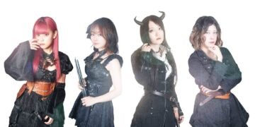 The photo shows the steampunk metal band FATE GEAR, dressed in dark gothic and steampunk inspired fashion standing next to eachother against a white background.